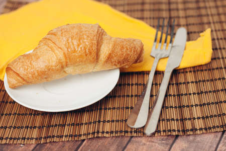 croissant in a plate on the table kitchenware breakfast mealの写真素材