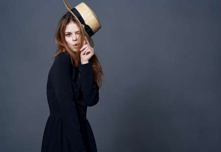 attractive woman in hat black dress luxury close-upの写真素材
