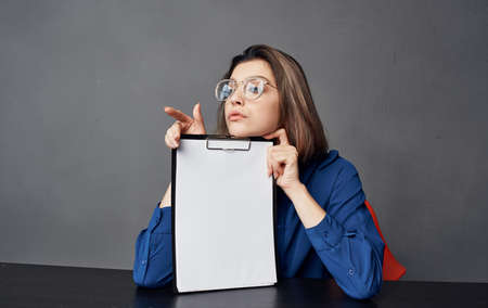 Business woman sitting at the table documents classic styleの写真素材