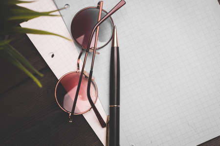 stationery notepads glasses paper with clip coffee cup flowerの写真素材