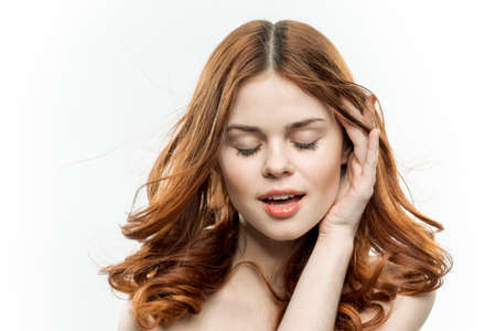 pretty woman loose ginger hair glamor naked shoulders modelの写真素材