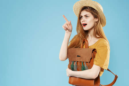 Pretty woman backpack fashion studio fun blue backgroundの写真素材