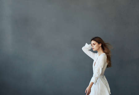 pretty woman and white dress glamor and luxury gray background modelの写真素材