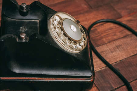 retro telephone old technology communication antique wood backgroundの写真素材