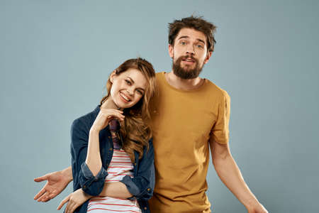 fashion couple emotions fun studio communication blue backgroundの写真素材