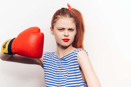 cheerful woman in striped t-shirt boxing gloves cropped viewの写真素材