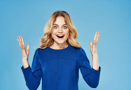 cheerful elegant woman lifestyle blue dress emotions studioの写真素材