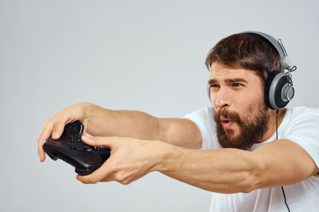 Male gamer headphone joystick hands holding entertainmentの写真素材