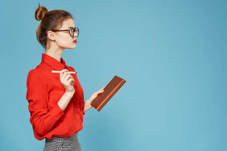 elegant woman red shirt secretary official office notepadの写真素材