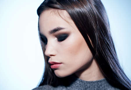 Close up portrait of beautiful brunette woman with evening make-up on her faceの写真素材