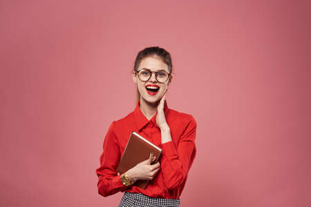 Woman wearing glasses red shirt secretary finance lifestyle Professionalの写真素材