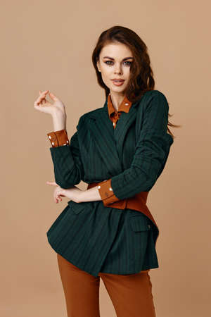 fashionable woman in trousers and blazer red shirt styleの写真素材