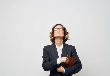 woman in classic suit documents book glasses finance businessの写真素材