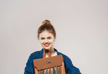 Pretty woman in trendy clothes backpack red lips studentの写真素材