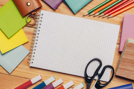multicolored pencils work desk stationery notepad close upの写真素材