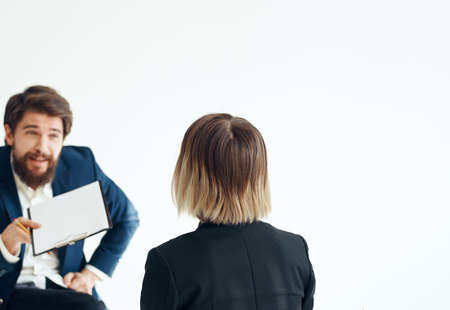 Business man and woman in suit on a light background communication staff job interviewの写真素材