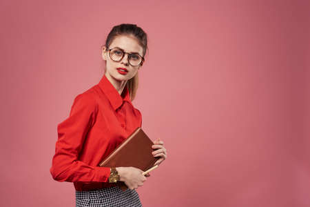 Woman wearing glasses red shirt secretary finance lifestyle Professionalの写真素材