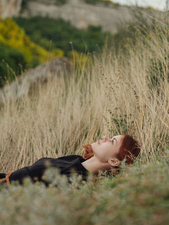 Traveler dry grass nature countryside mountains modelの写真素材