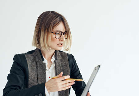 Emotional woman holding documents business finance classic suit