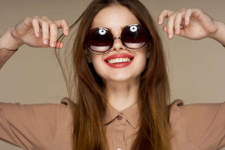 fashionable woman with glasses smile attractive look close-upの写真素材