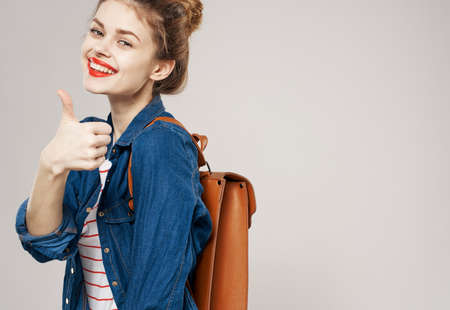 Cheerful woman with backpack fashion student glamor close upの写真素材