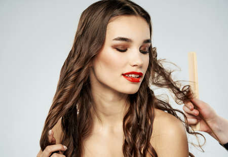 Woman barber hair care makeup naked shoulders modelの写真素材