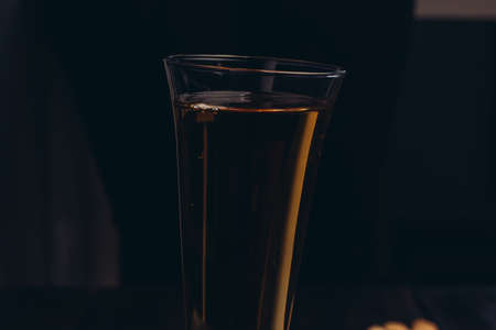 glass of beer the dark background bar alcoholの写真素材