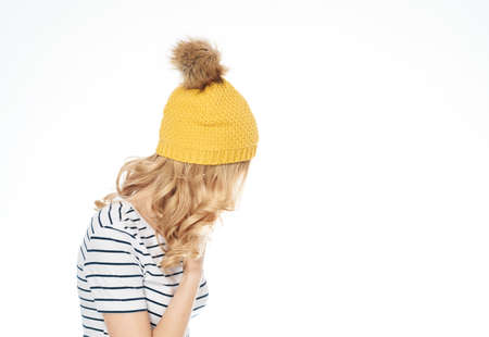 pretty woman in striped t-shirt yellow hat fashion lifestyle light background