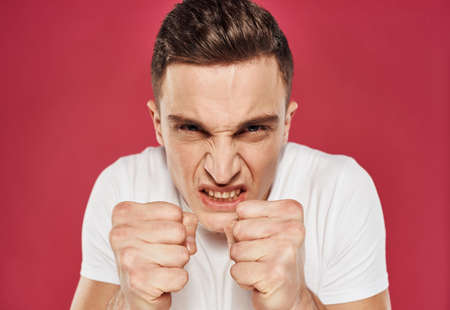 angry man in t-shirt discontent irritability close-up