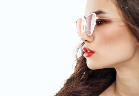 Side view portrait of beautiful woman in sunglasses brunetteの写真素材