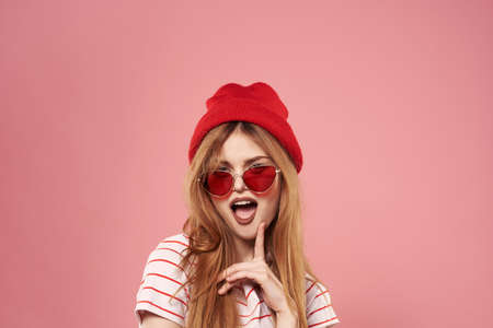 Cheerful glamorous woman lifestyle luxury charm pink backgroundの写真素材