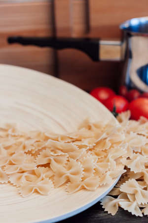 italian pasta cooking or cherry tomatoes cuisine lunchの写真素材