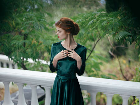Woman outdoors romance luxury summer green dressの写真素材
