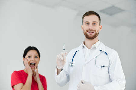 patient with open mouth is afraid of injections vaccination emotionsの写真素材