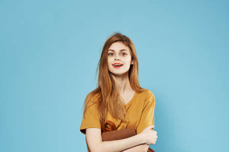 Pretty woman elegant style fashion clothes Studio cosmetics blue backgroundの写真素材