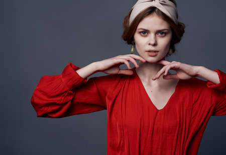 Pretty elegant woman in red dress decoration luxury glamor