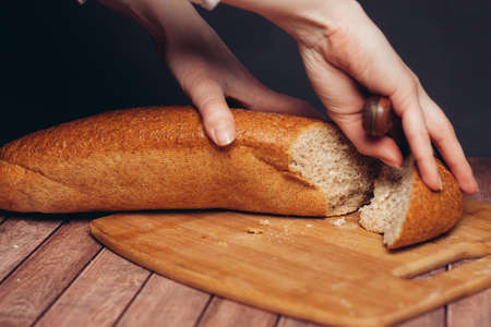 fresh sliced loaf yellow napkin wooden table baked goodsの写真素材