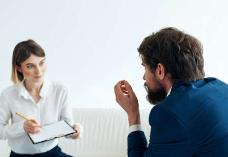 recruiting vacancies woman with documents and man in suitの写真素材