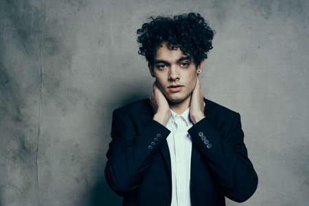 funny man in suit curly hair fashion self confidenceの写真素材