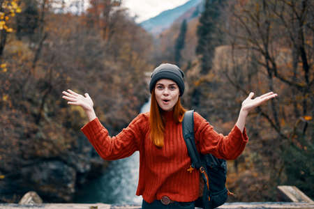 emotional woman hiker near river joy travel mountainsの写真素材