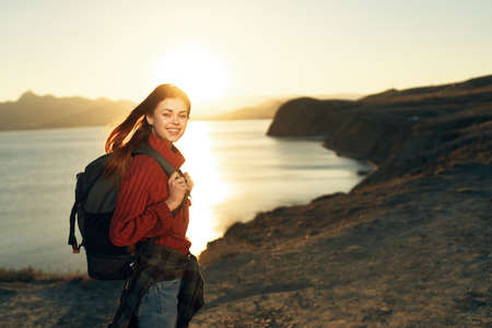 Woman tourist backpack travel nature landscape adventureの写真素材