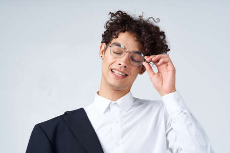 business man jacket on shoulder glasses manager close-up studioの写真素材