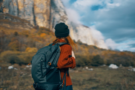 travel tourism woman with backpack high mountains sky landscapeの写真素材