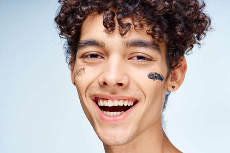 Cheerful guy curly hair cream mask cosmetologyの写真素材