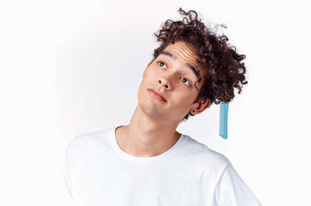 emotional man with comb curly hair close-up