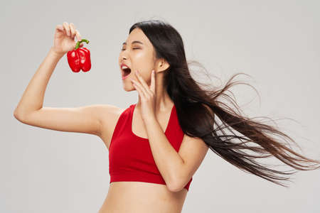 slender woman bell pepper healthy food vegetarianの写真素材