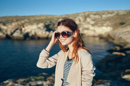 happy traveler soccer blessed near the sea in the mountains and sun summer glassesの写真素材