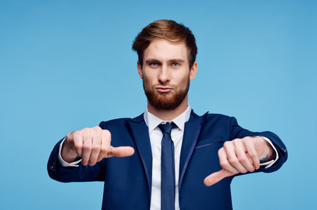 cheerful business man in a suit gesturing with his hands emotions studio