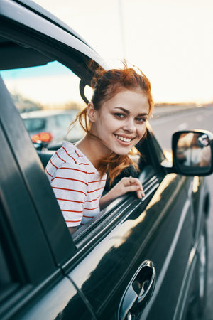 woman in striped t-shirt red hair car window salon model