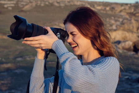 cheerful woman photographer professional outdoors landscape rocky mountains